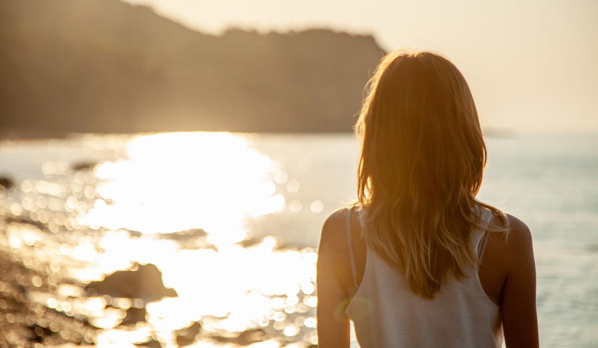 sun, water, and woman