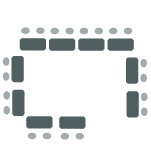 Tables arranged around the parameter of the room with two chairs behind each table. 